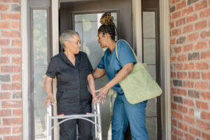 Senior women going for a walk with caregiver