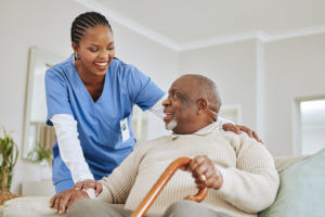 Home health nurse talking to her patient about starting his stroke rehabilitation exercises at home.